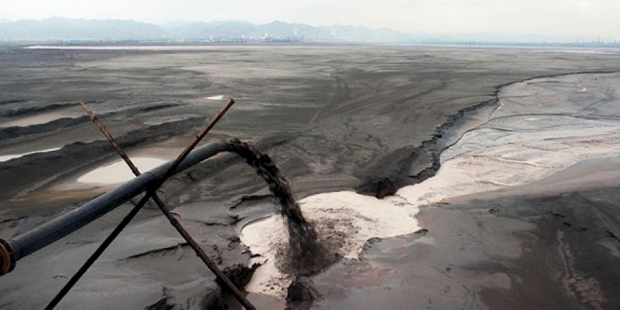 A vast toxic lake surrounds Baotou, Mongolia, the result of mining and processing the region's rare earth minerals.