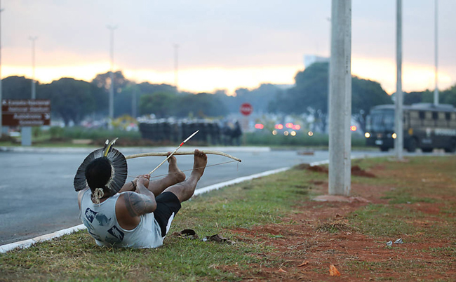 Amerindians clash with the police in Brasilia while protesting for land rights and against the 2014 World Cup hosted by Brazil.