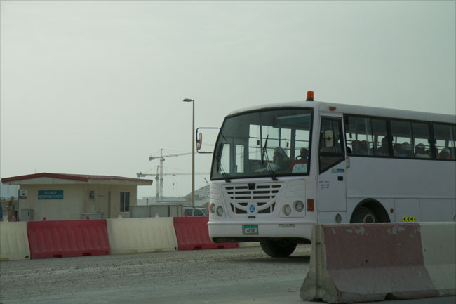 Workers are transported from the construction site on Saadiyat Island to their accommodation camps on March 17, 2015.