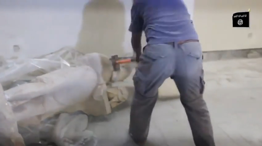 Islamic State members destroy artifacts in the Mosul Museum. Still from a video released by <em>al-Furqān Media,</em> February 26, 2015.